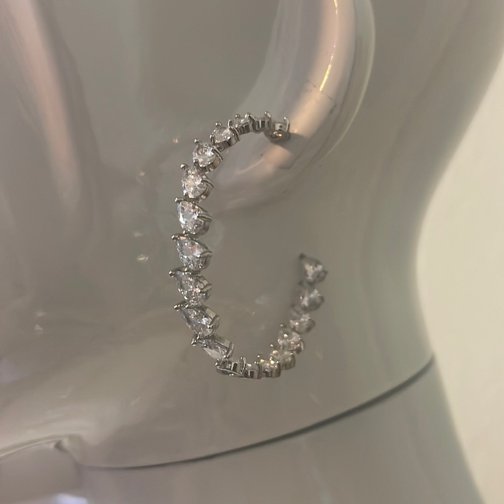 Hoop earrings with pear shaped cz’s